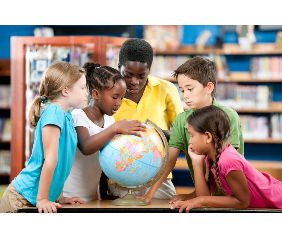 Diverse students collaborating around a globe in the library